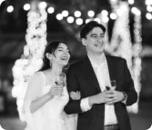Couple in black and white cheersing